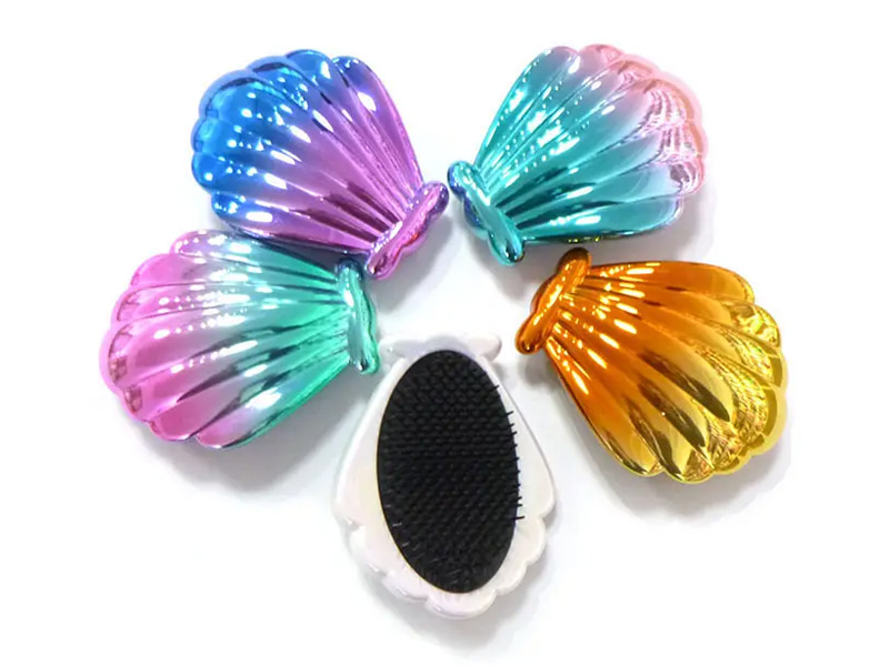 Muschelförmige, galvanisierte Mini-Entwirrungsbürste für Kinderhaare