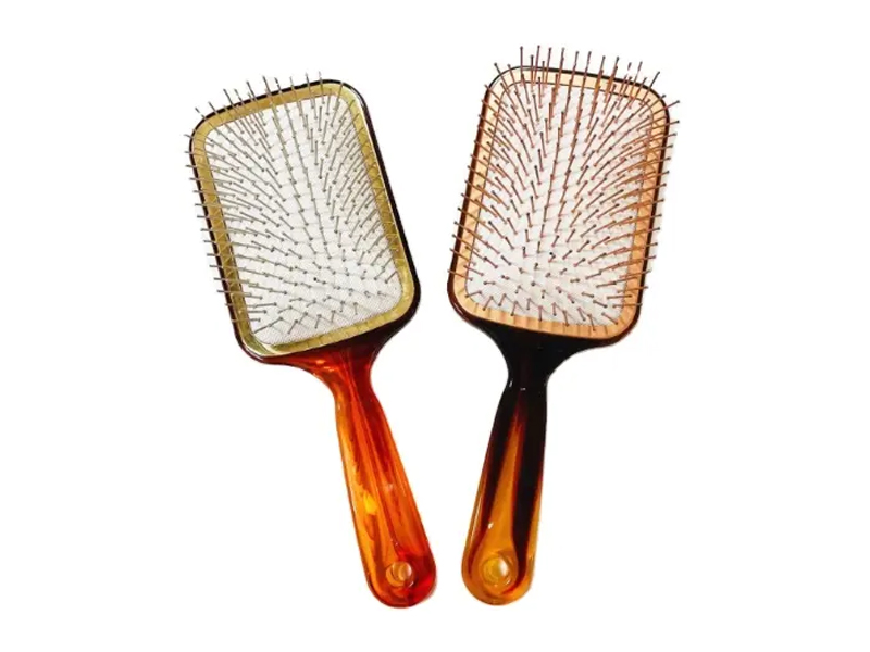 Bernsteinfarbene Paddle-Haarbürste mit Metallstiften
